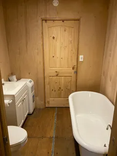a bathroom with a sink a toilet and bathtub
