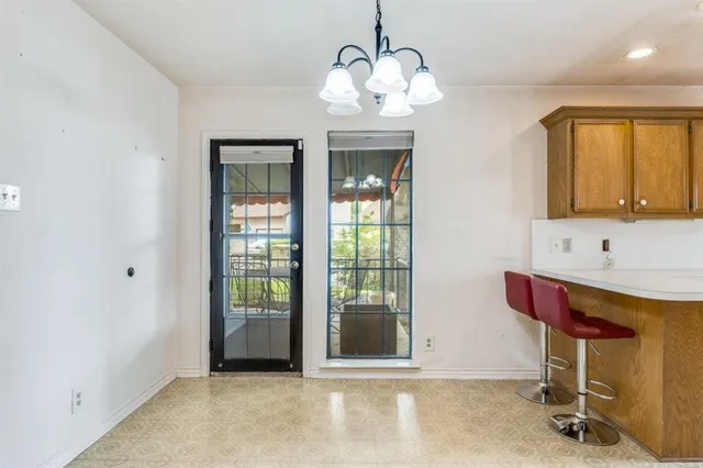 a view of entryway with a chandelier