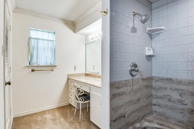 a bathroom with a tub and a shower