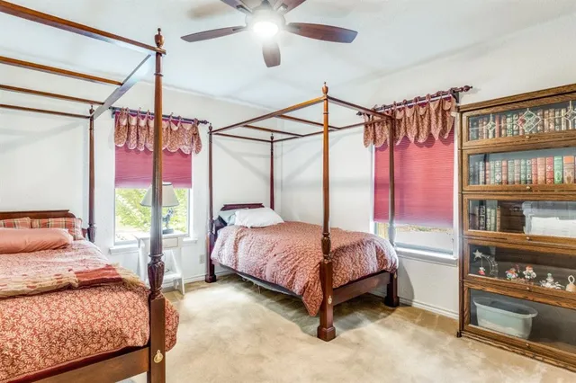 a bedroom with a bed window and a walk in closet
