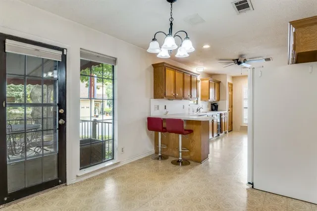 a view of a livingroom with furniture a livingroom with furniture wooden floor and a chandelier