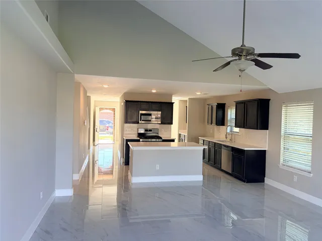 a view of living room with furniture and flat screen tv