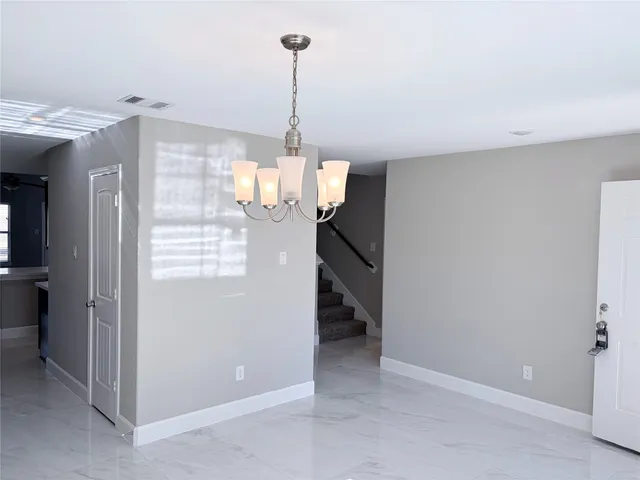 a view of a room with a chandelier