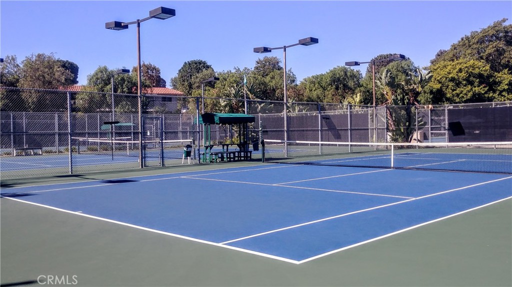 912 Ronda Sevilla, Unit O Laguna Woods, CA 92637 - Photo 47 of 55 a view of a tennis court with basket ball court