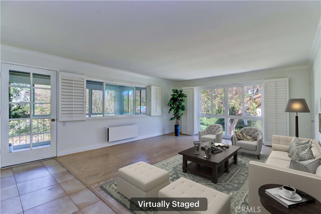 912 Ronda Sevilla, Unit O Laguna Woods, CA 92637 - Photo 5 of 55 a living room with furniture and a large window
