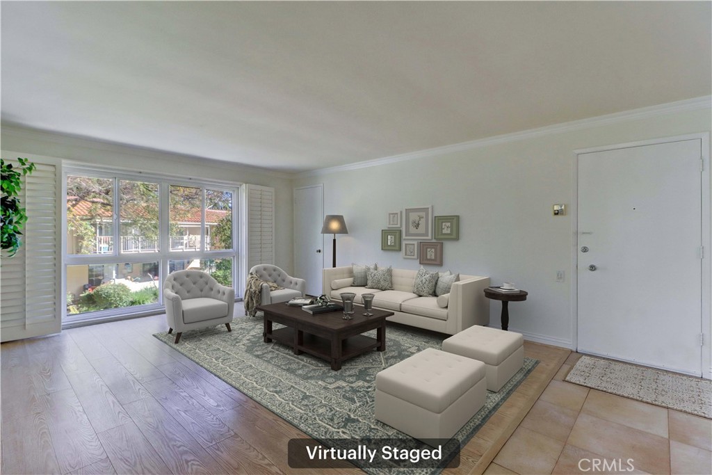 912 Ronda Sevilla, Unit O Laguna Woods, CA 92637 - Photo 7 of 55 a living room with furniture and a large window