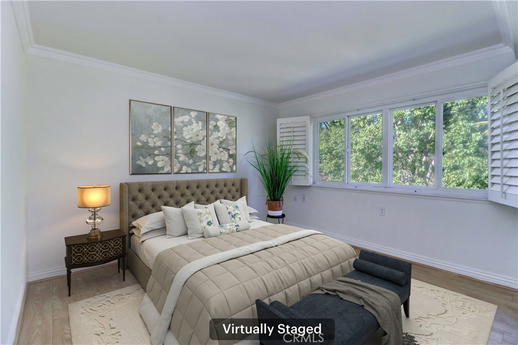 912 Ronda Sevilla, Unit O Laguna Woods, CA 92637 - Photo 8 of 55 a bedroom with a bed and a window