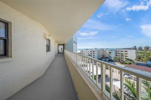 a view of a house with backyard and porch