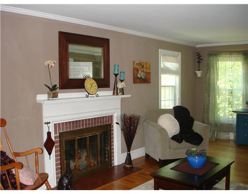 5 Milton Road Barrington, RI 02806 - Photo 9 of 10 Living Room. FRONT TO BACK LIVING ROOM WITH FIREPLACE AND HARDWOODS.