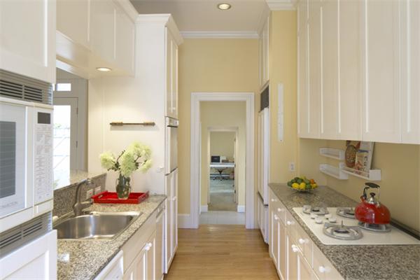 32 Ash Street Cambridge, MA 02138 - Photo 5 of 10 a kitchen with granite countertop a sink stove and cabinets