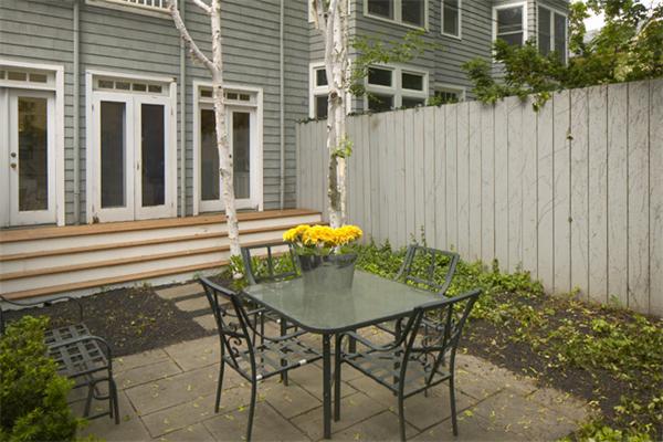 32 Ash Street Cambridge, MA 02138 - Photo 10 of 10 a backyard of a house with table and chairs