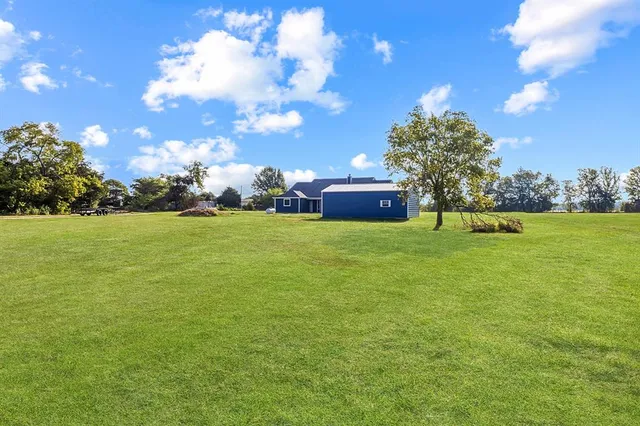 a living room with fireplace furniture and a flat screen tv
