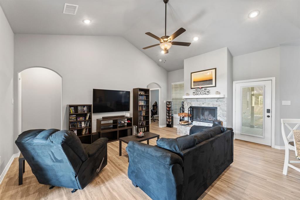 27084 Fm 47 Wills Point Wills Point, TX 75169 - Photo 15 of 36 a living room with fireplace furniture and a flat screen tv