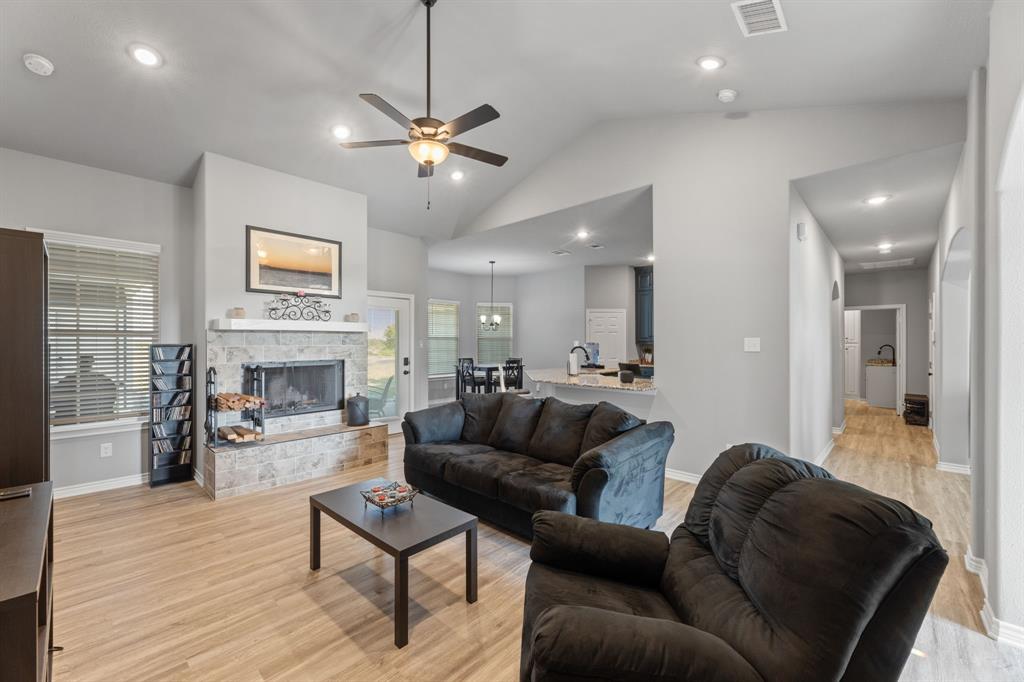 27084 Fm 47 Wills Point Wills Point, TX 75169 - Photo 17 of 36 a living room with furniture a fireplace and a flat screen tv