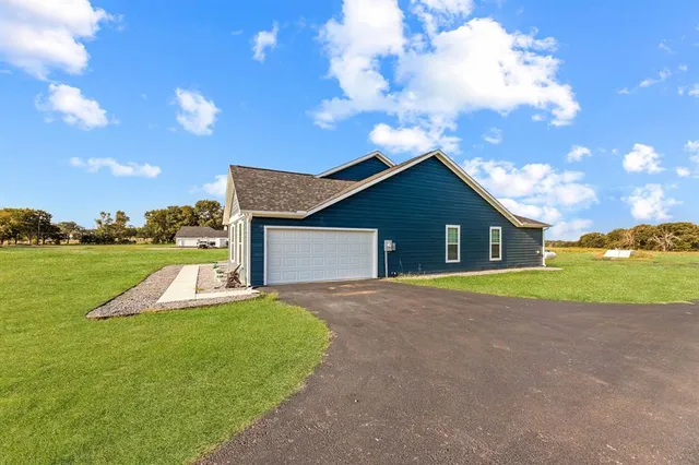 a view of outdoor kitchen with green space
