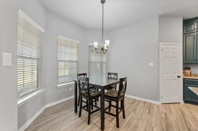 a kitchen with granite countertop stainless steel appliances cabinets a sink and a counter top space