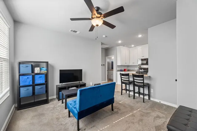 a living room with furniture and a window