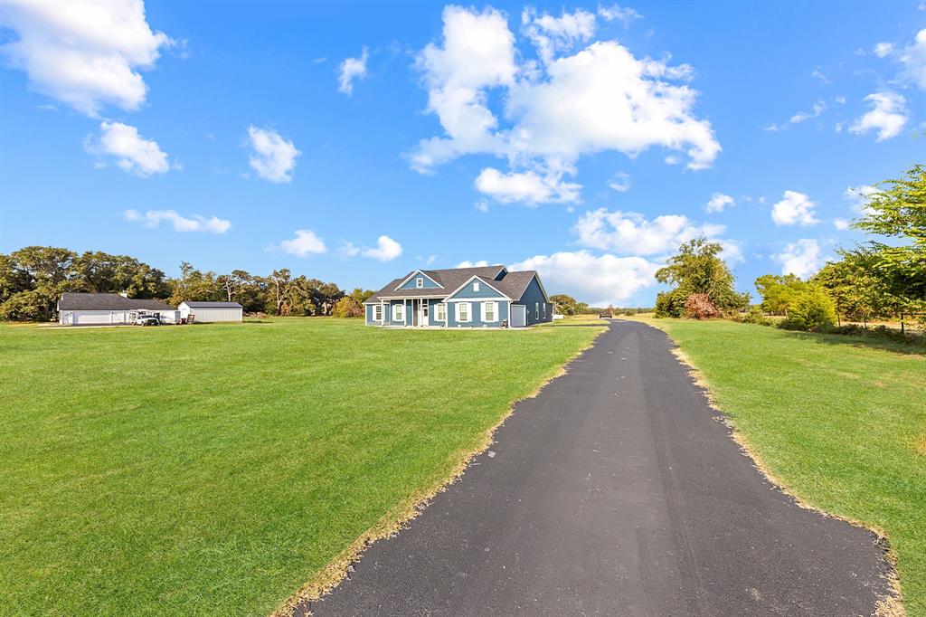 27084 Fm 47 Wills Point Wills Point, TX 75169 - Photo 9 of 36 a view of a garden with a house in the background