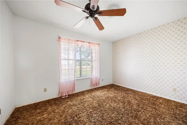 a view of an empty room and window