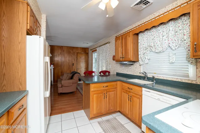 a kitchen with a sink and a refrigerator