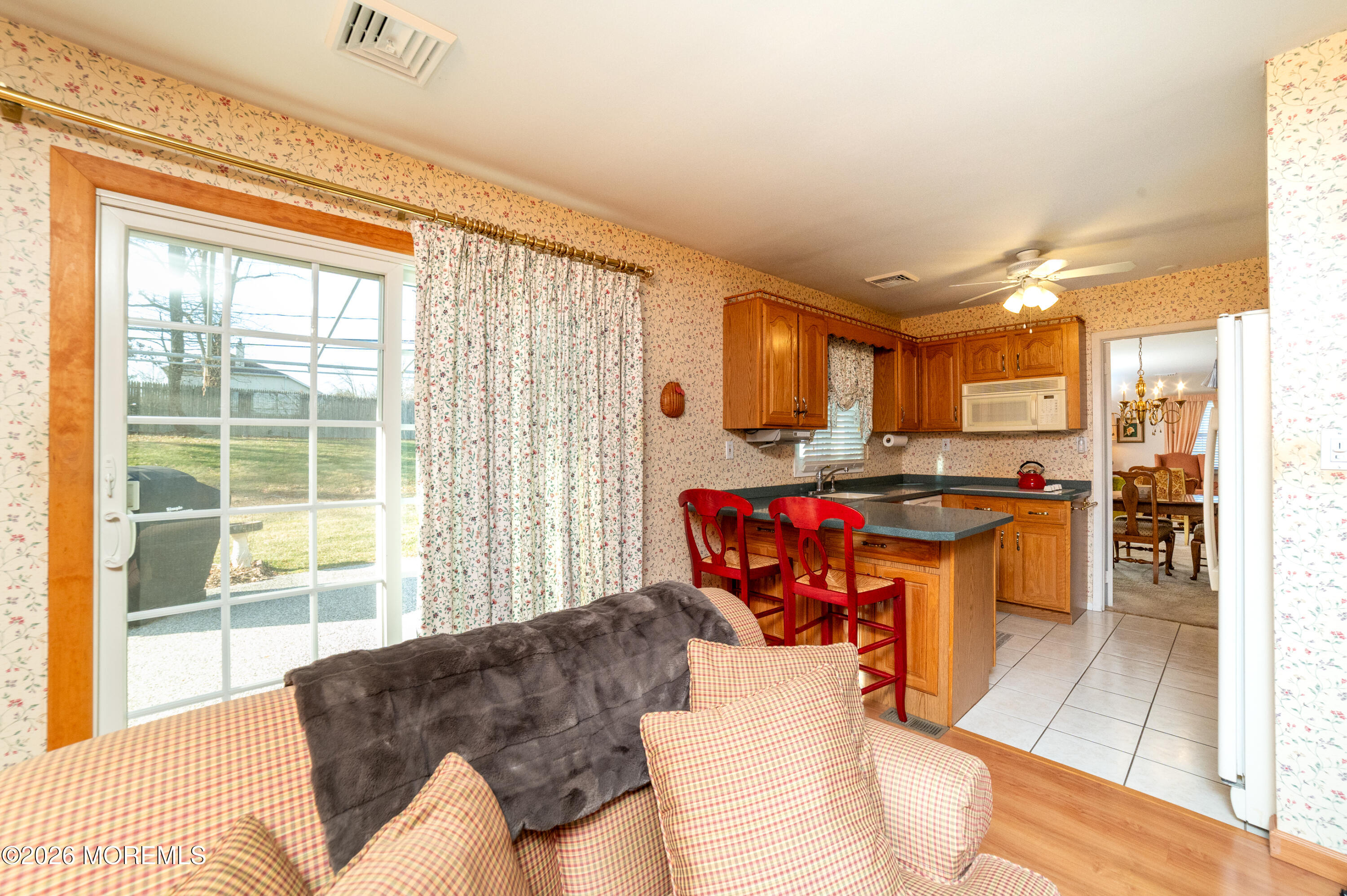 2 Brentwood Road Matawan, NJ 07747 - Photo 12 of 36 a living room with furniture and a open kitchen view