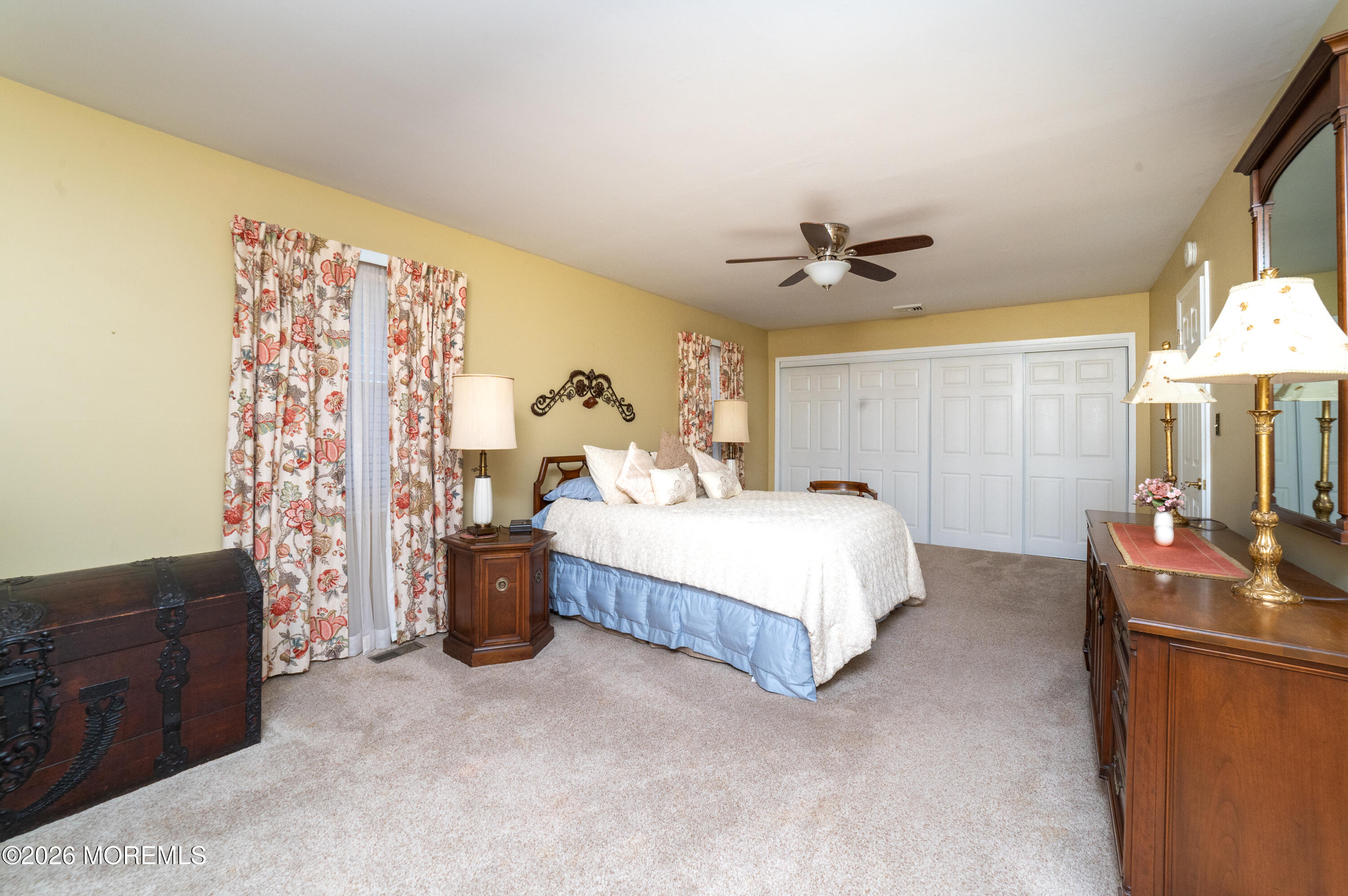 2 Brentwood Road Matawan, NJ 07747 - Photo 16 of 36 a bed room with a bed and a chandelier