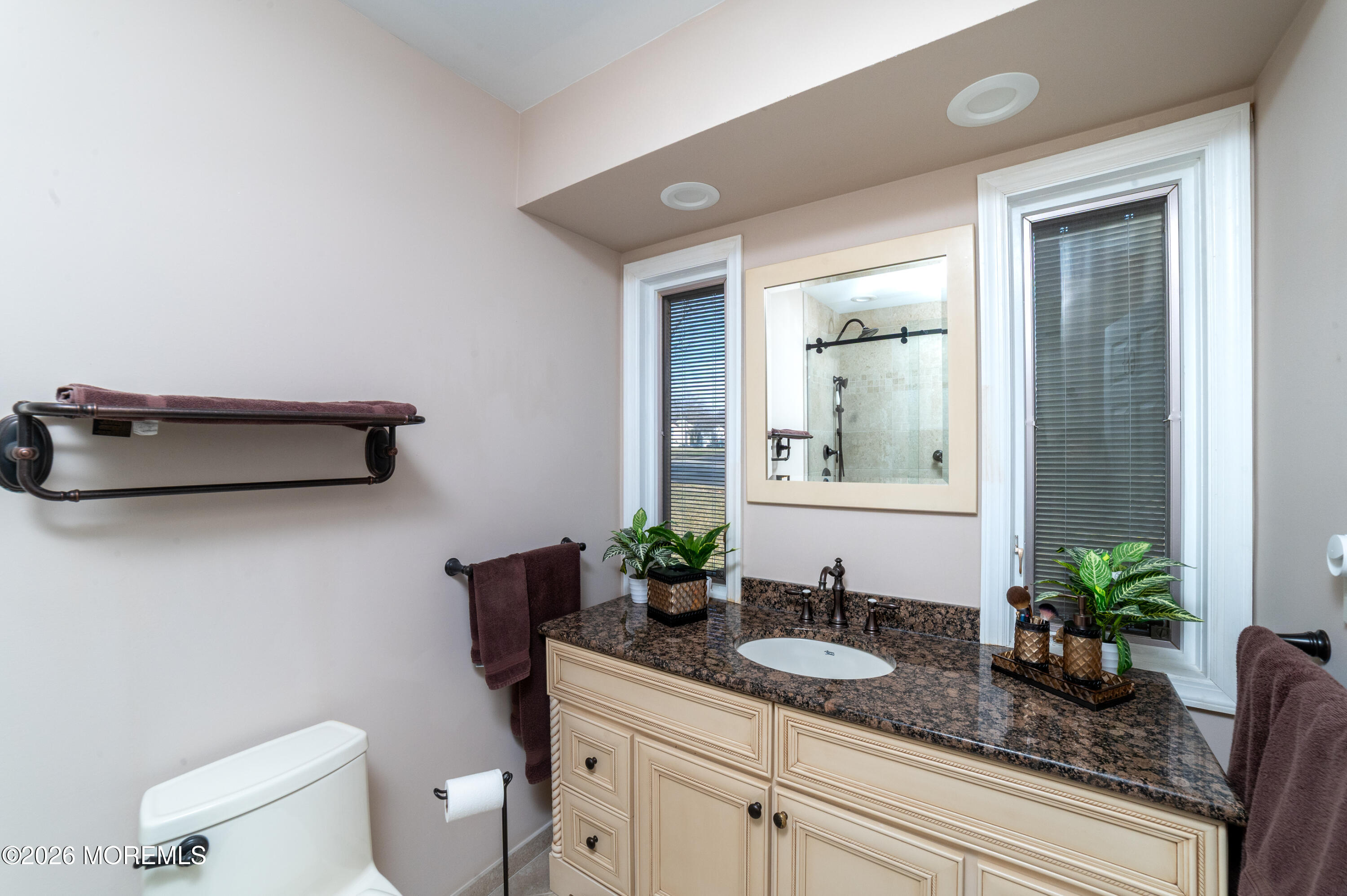 2 Brentwood Road Matawan, NJ 07747 - Photo 19 of 36 a bathroom with a granite countertop sink a toilet and mirror