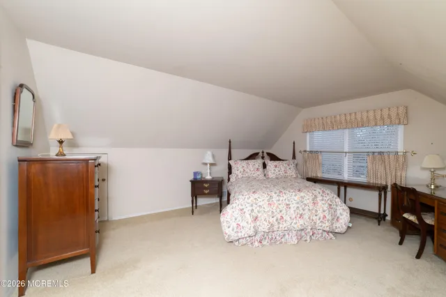 a bedroom with a bed and a cabinets