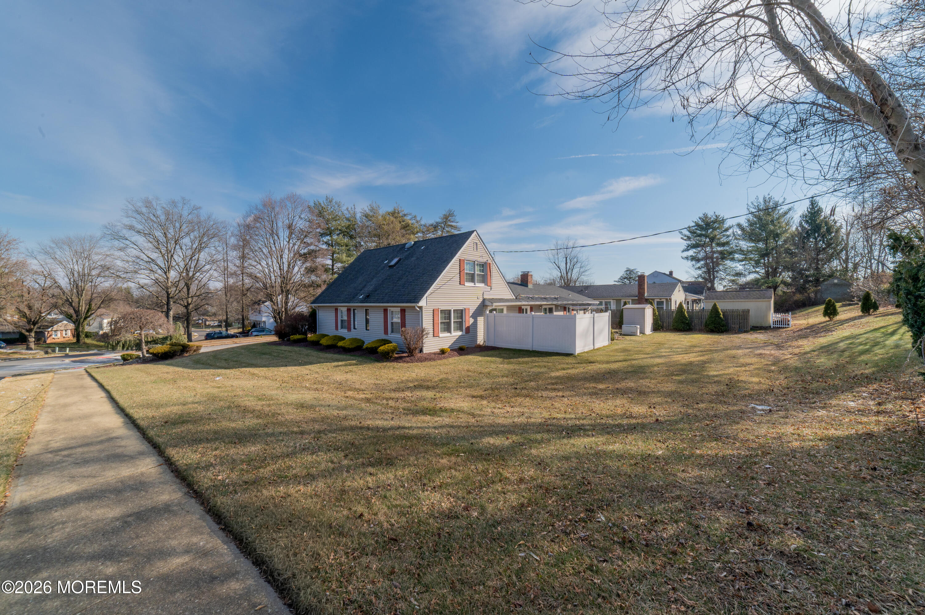 2 Brentwood Road Matawan, NJ 07747 - Photo 36 of 36 a yellow house with trees in front of it