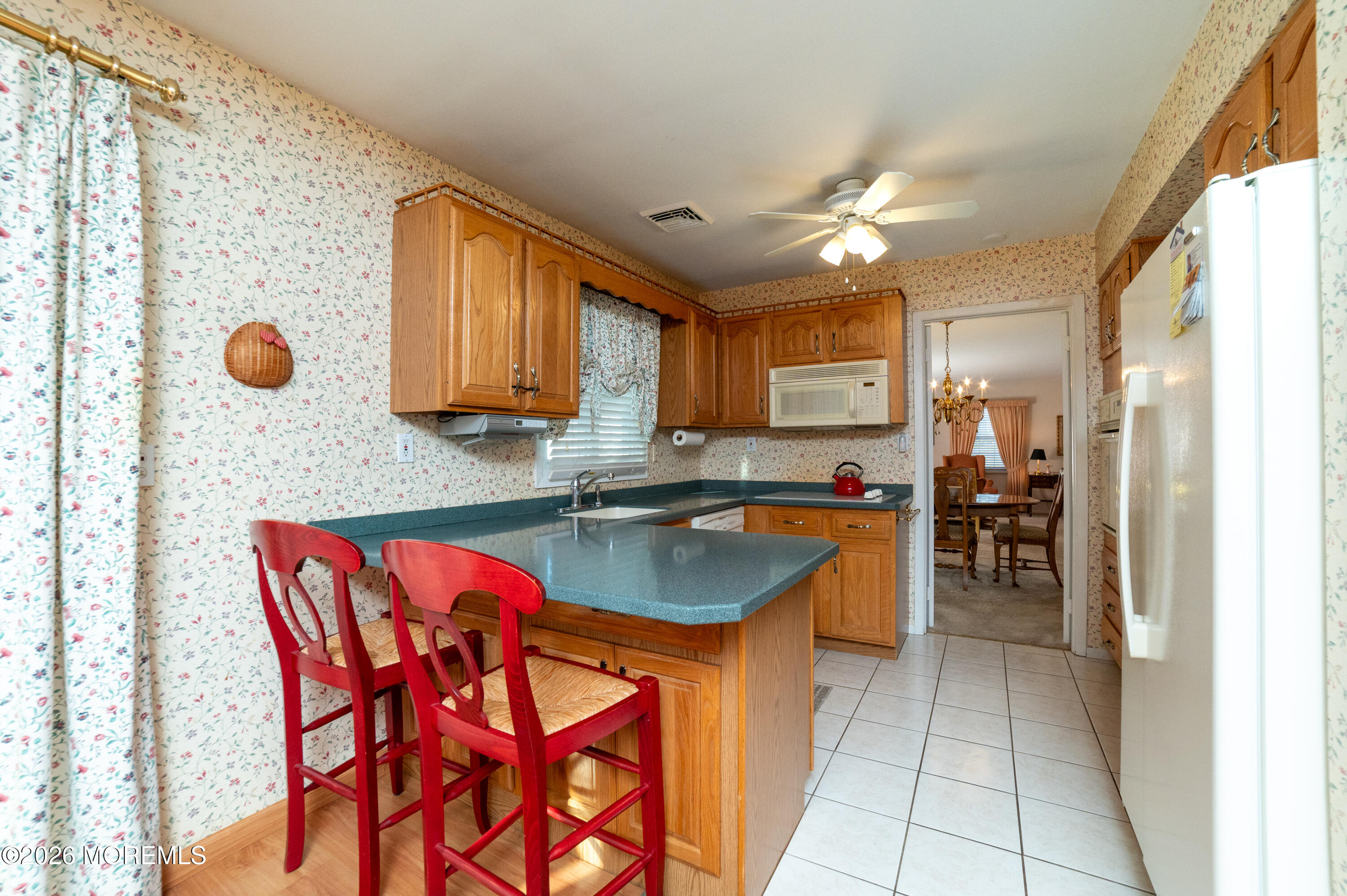 2 Brentwood Road Matawan, NJ 07747 - Photo 9 of 36 a kitchen with a table chairs sink and cabinets