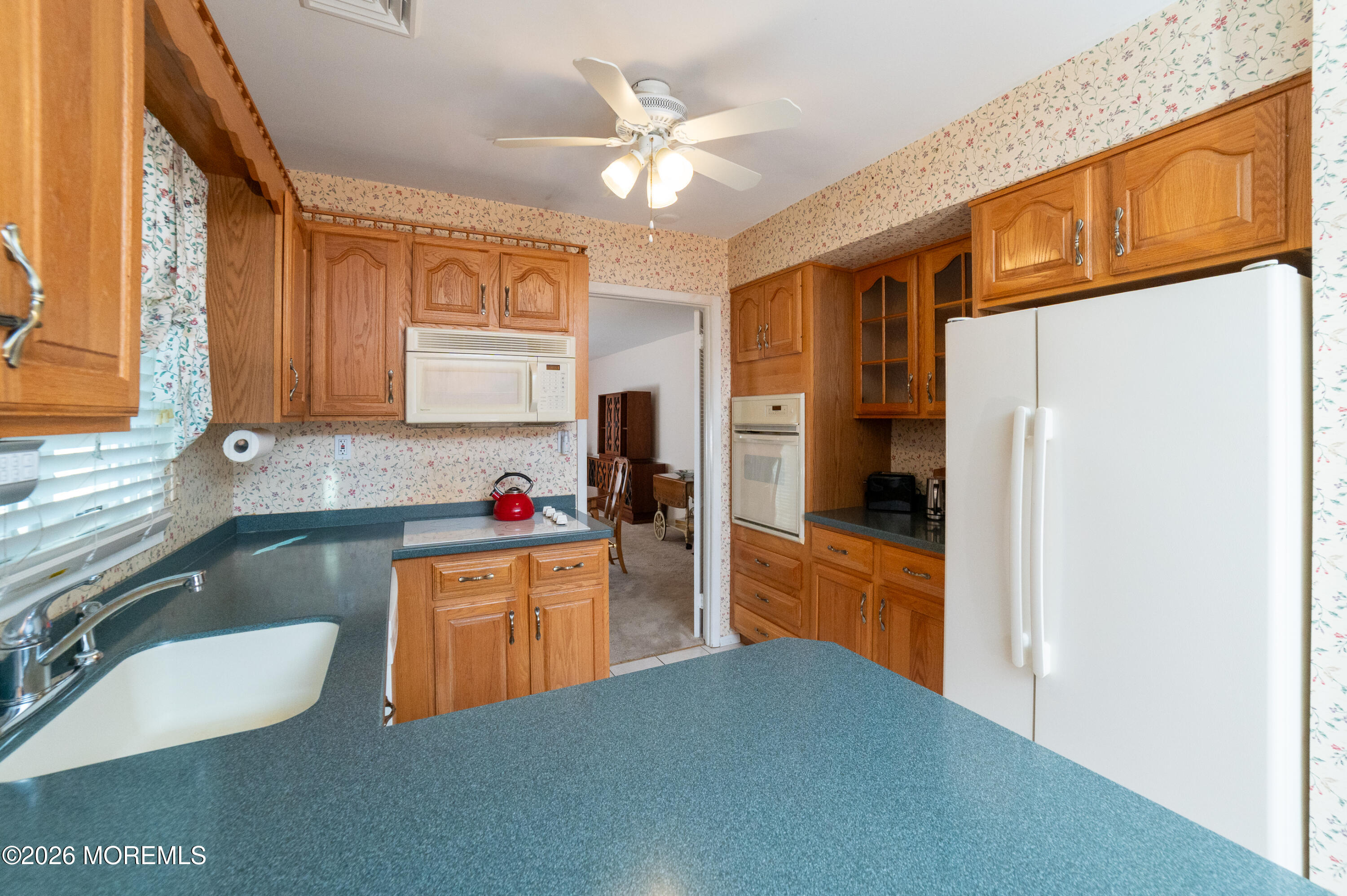 2 Brentwood Road Matawan, NJ 07747 - Photo 10 of 36 a kitchen with refrigerator and cabinets