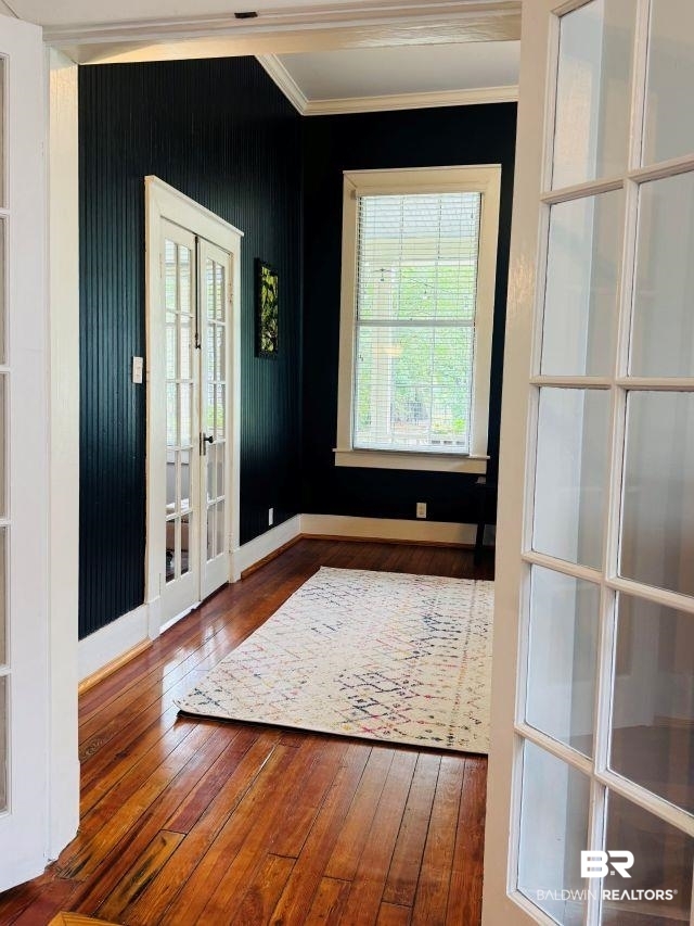 54 South Catherine Street Mobile, AL 36604 - Photo 12 of 55 A view of dining room to highlight the attractive French doors, the great windows, crown moldings, and flooring. This home really is incredible and worth the look!