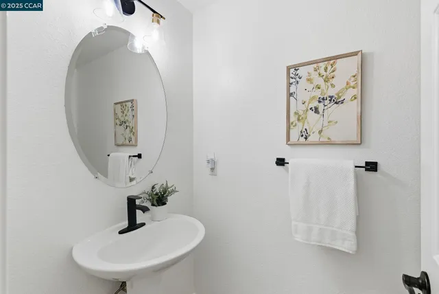 a bathroom with a sink and mirror