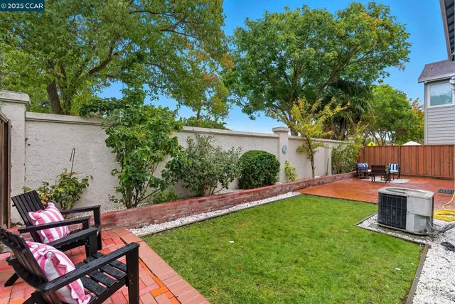 a view of yard with seating area and green space