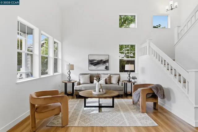 a living room with furniture and windows