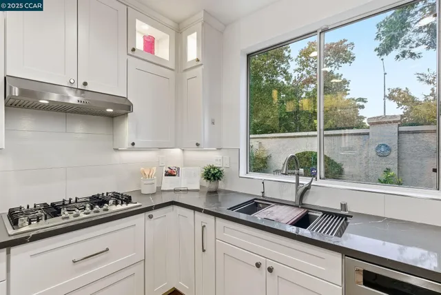 a kitchen with a sink and cabinets