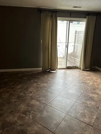 a living room with cabinets
