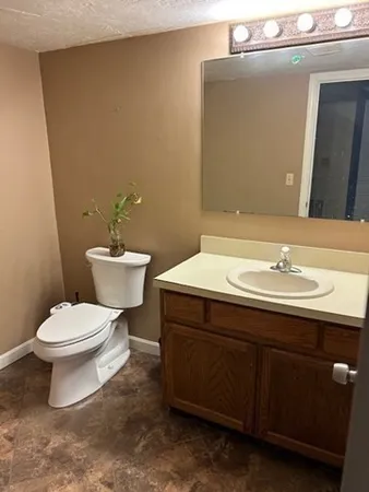 a view of an empty room with windows