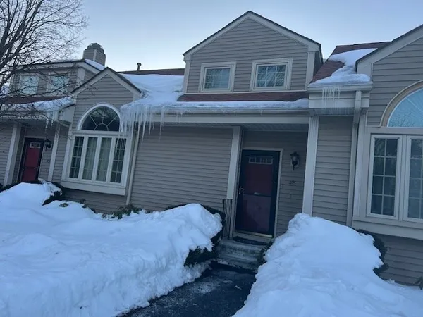 a white toilet sitting next to a shower curtain