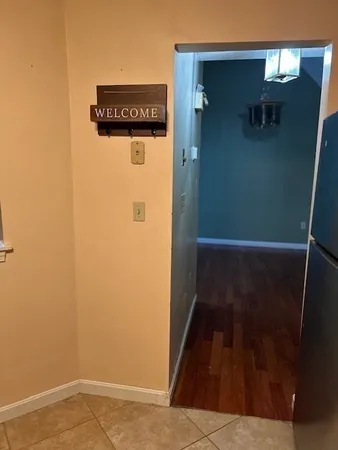 a kitchen with a stove top oven cabinets and refrigerator