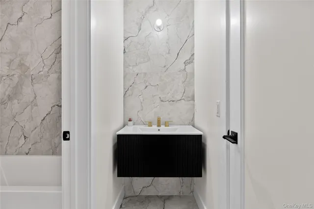 a bathroom with a bathtub and toilet