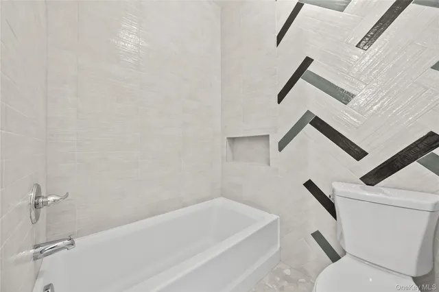 a view of a hallway with a white walls