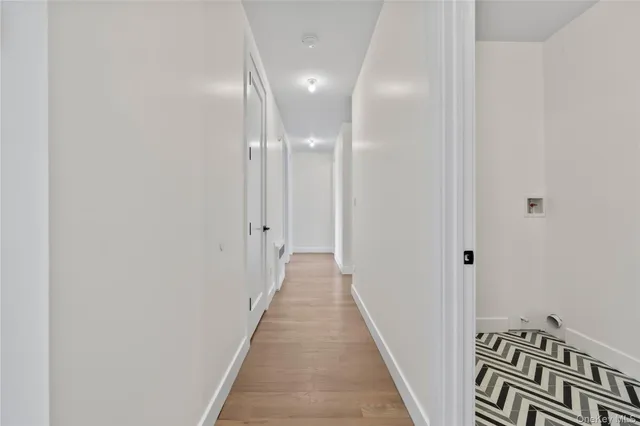 an aerial view of a house with pool and chairs