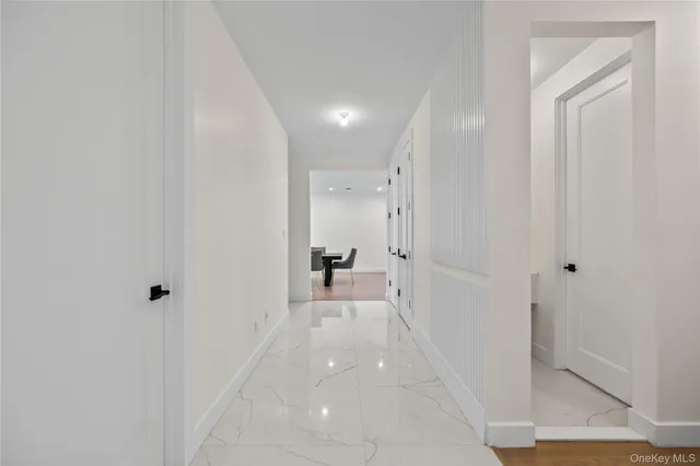 a view of a hallway with a room