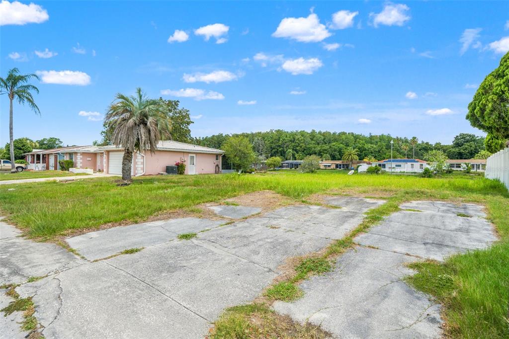 7211 Ashwood Drive Port Richey, FL 34668 - Photo 11 of 12 a view of a patio with a garden