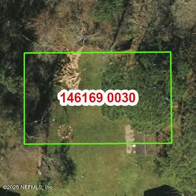 0 Chamfort Road Jacksonville, FL 32246 - Photo 3 of 4 a sign that is on the side of a road