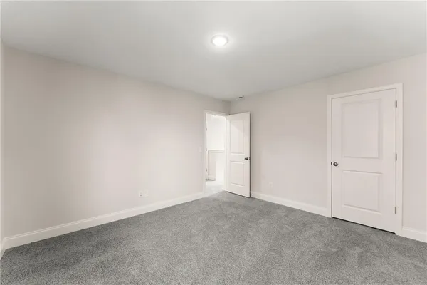 a view of an empty room and a window