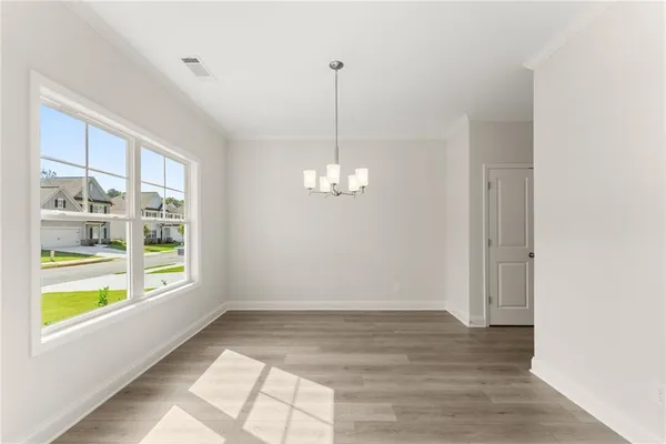 a view of a room with window wooden floor and windows