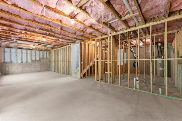 a view of empty room with wooden walls
