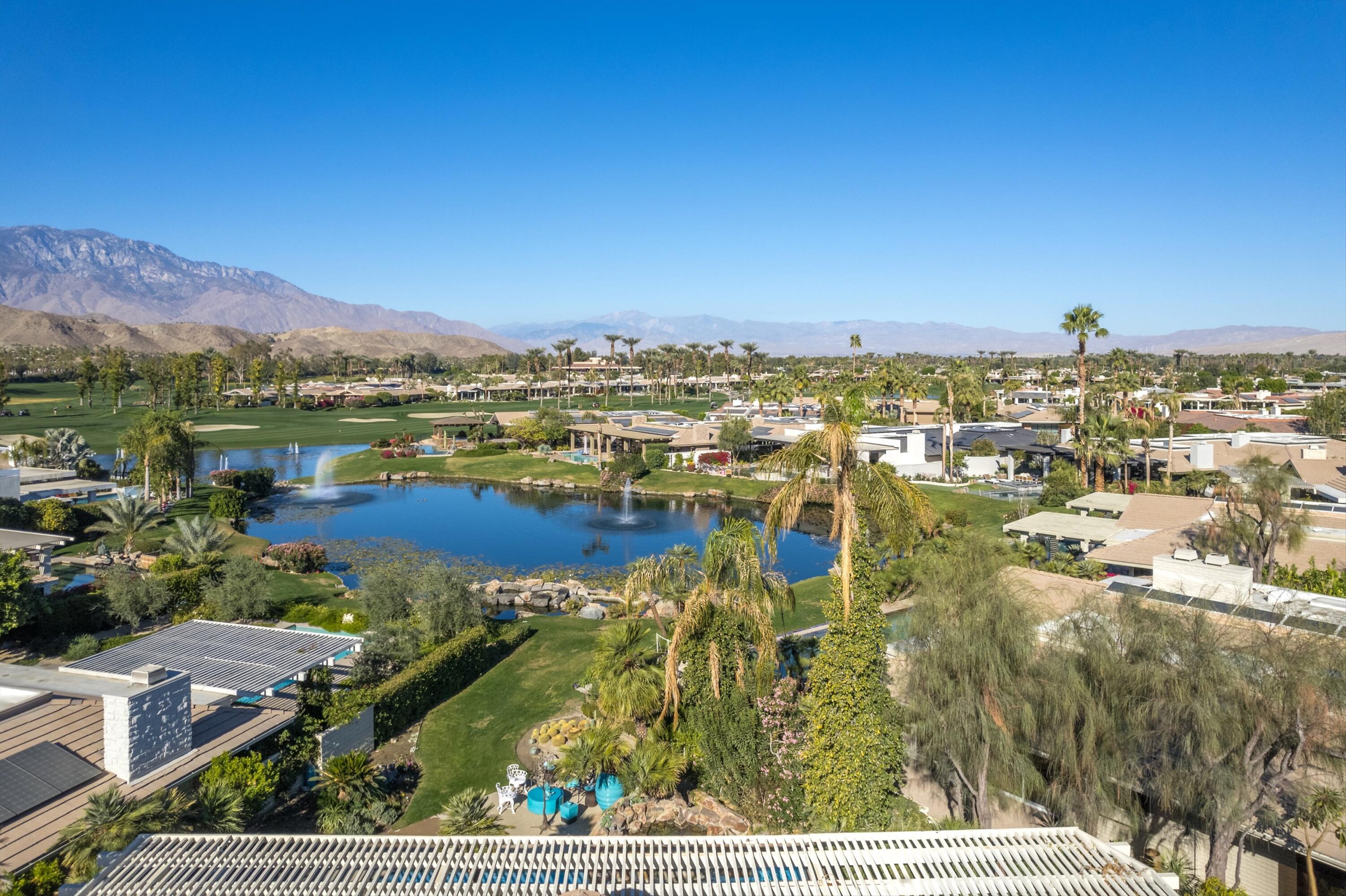 42 Fincher Way Rancho Mirage, CA 92270 - Photo 3 of 43 Drone view of backyard & lagoon